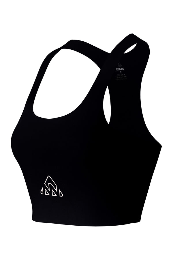  buy running sport bra | running apparel women miami -  Angled front view of a black women's sports top featuring champagne-colored logos, isolated against a white background to highlight the side cut.