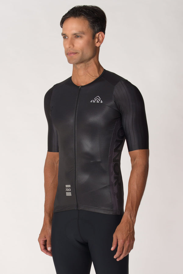   A photo of a men's biking top with short sleeves. This male cycling shirt is designed for optimal comfort and style, making it perfect for any biking adventure.