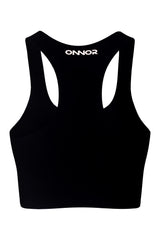 Rear view of a sleek black women's top, designed for athletics and fitness, with champagne logos, against a white backdrop to detail the back design.