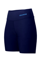 Diagonal front-side view of women's blue shorts with a zipper pocket on the top back. This angle showcases both the front and the side aspects of the shorts, highlighting their stylish cut.