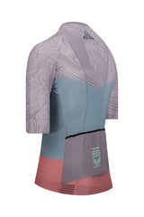 Focused image on the fabric texture of ONNOR's Women's Nut Pro Cycling Jersey Short Sleeve in light brown and salmon colors. Showcases the quality, breathability, and durability of the jersey, testifying to the brand's commitment to producing resilient, performance-enhancing cycling wear.