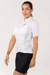 A short-sleeved women's cycling top. The top features a vibrant and energetic pattern, adding a pop of color to the cyclist's ensemble. It is designed with a lightweight and stretchable fabric, offering a comfortable and unrestricted fit.