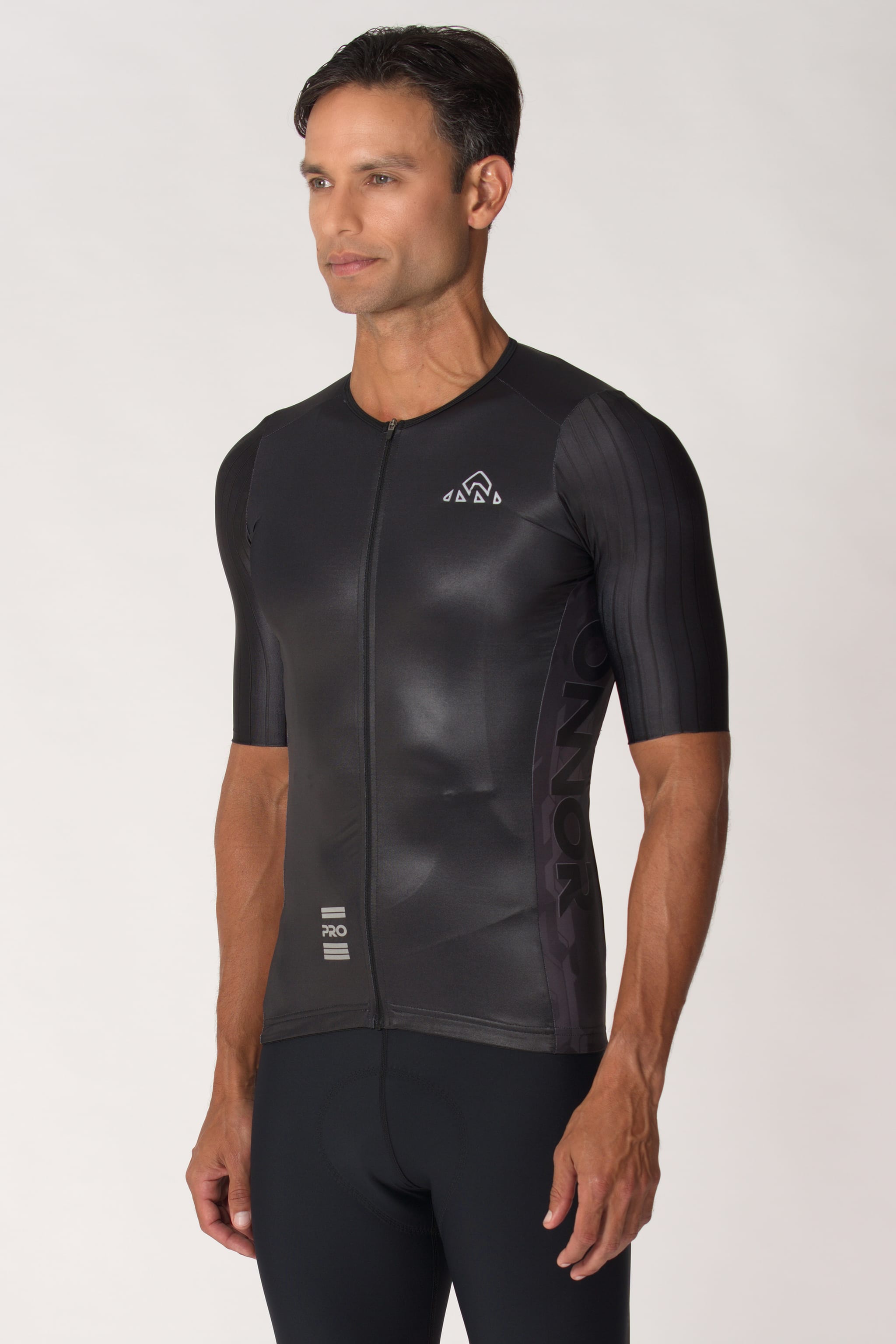 A photo of a men's biking top with short sleeves. This male cycling shirt is designed for optimal comfort and style, making it perfect for any biking adventure.