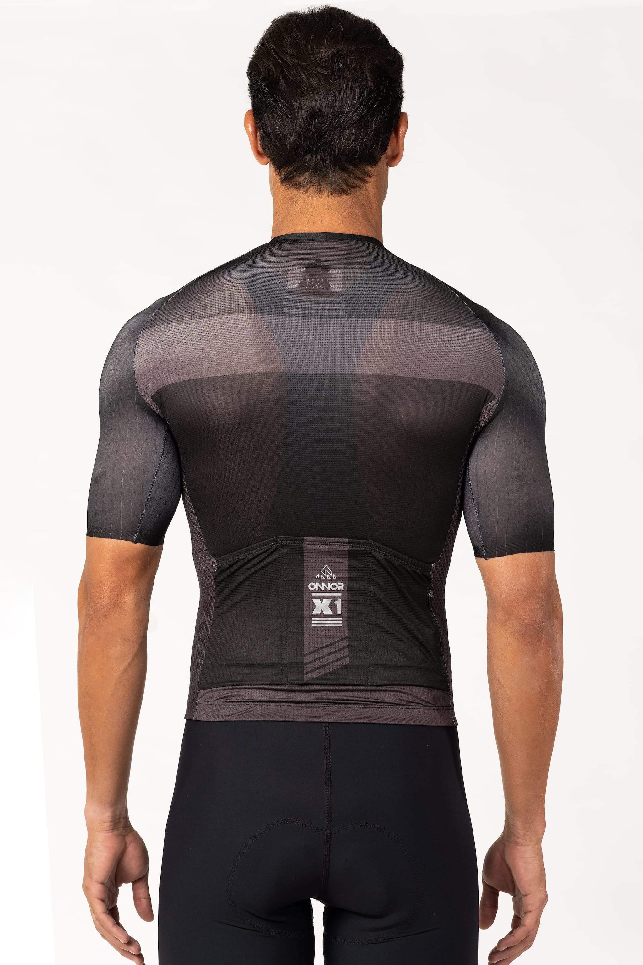 A male cyclist wearing a vibrant cycling shirt with short sleeves. This men's bicycle jersey is designed to provide optimal breathability and comfort during long rides.