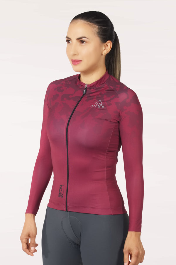  best cycling jersey long sleeve | stay warm and comfortable on your ride  -  A ladies' cycling jersey with short arms, shown in motion as a cyclist speeds by. The jersey has a modern design and offers breathability and flexibility.