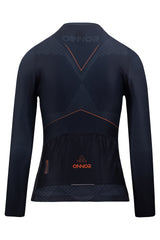 An image of a female cyclist wearing a women's cycling shirt with prolonged arms. The long-sleeved jersey is ideal for colder conditions and offers full arm coverage. It is designed to cater to the specific needs of women riders, providing a comfortable and stylish fit. This female cyclist's long sleeve jersey ensures enhanced performance and protection.