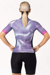 A short-sleeve jersey for female cyclists. The jersey has a sleek and aerodynamic silhouette, optimized for speed and performance. It is made of a technical fabric that promotes breathability and reduces wind resistance.
