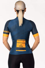 A women's biking top in a short-sleeved design. The top is made of a lightweight and moisture-wicking material, keeping the cyclist cool and dry during intense workouts. It has a sleek and fitted silhouette, providing a streamlined look.