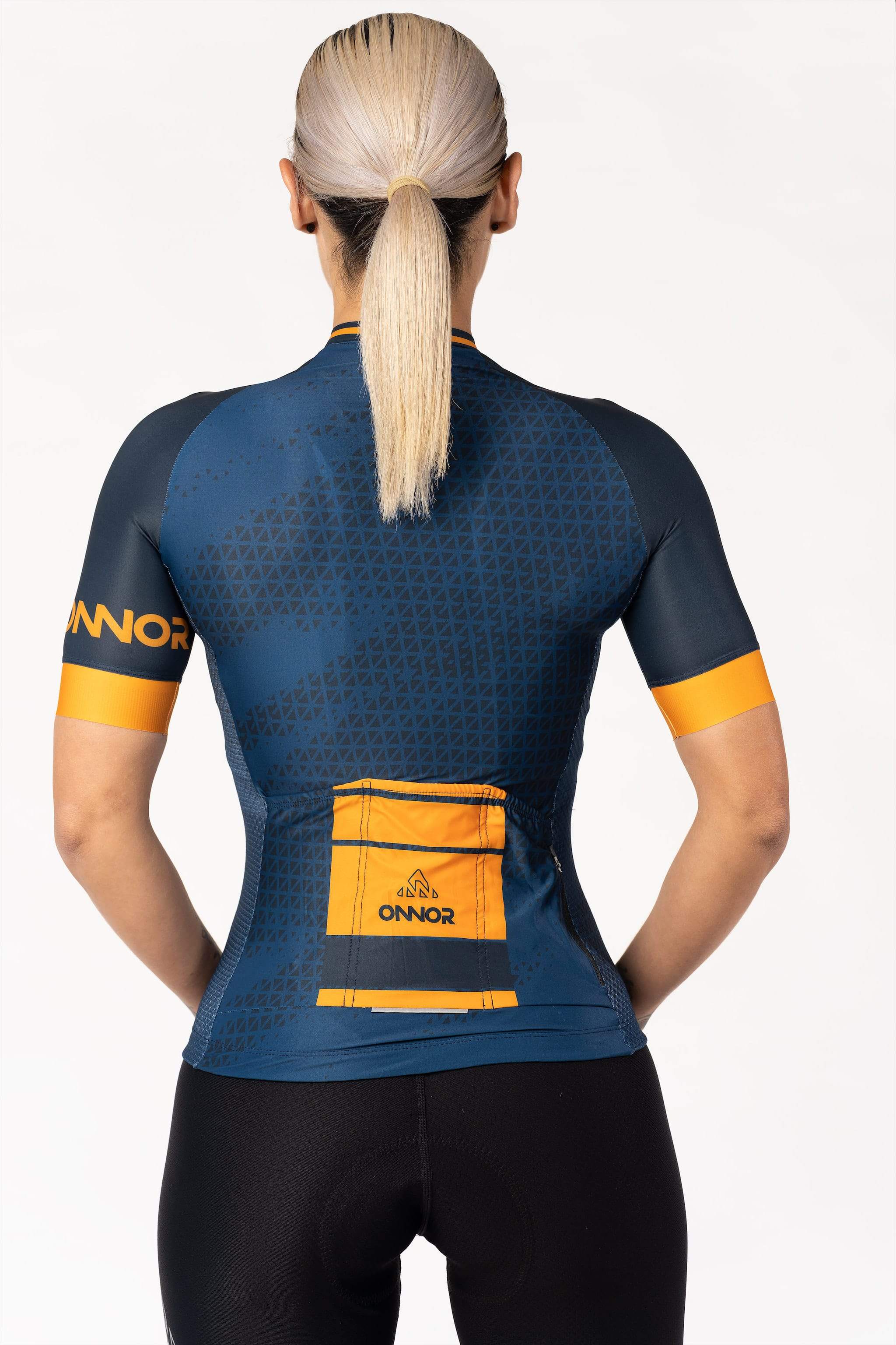 A women's biking top in a short-sleeved design. The top is made of a lightweight and moisture-wicking material, keeping the cyclist cool and dry during intense workouts. It has a sleek and fitted silhouette, providing a streamlined look.